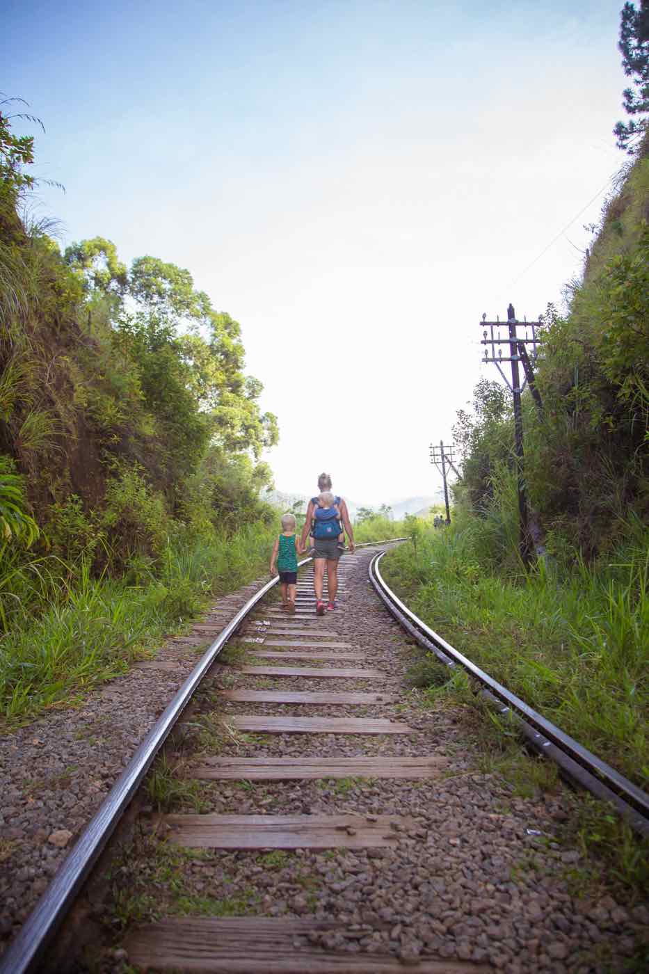 A family walking together along a railway track on a Zwela adventure