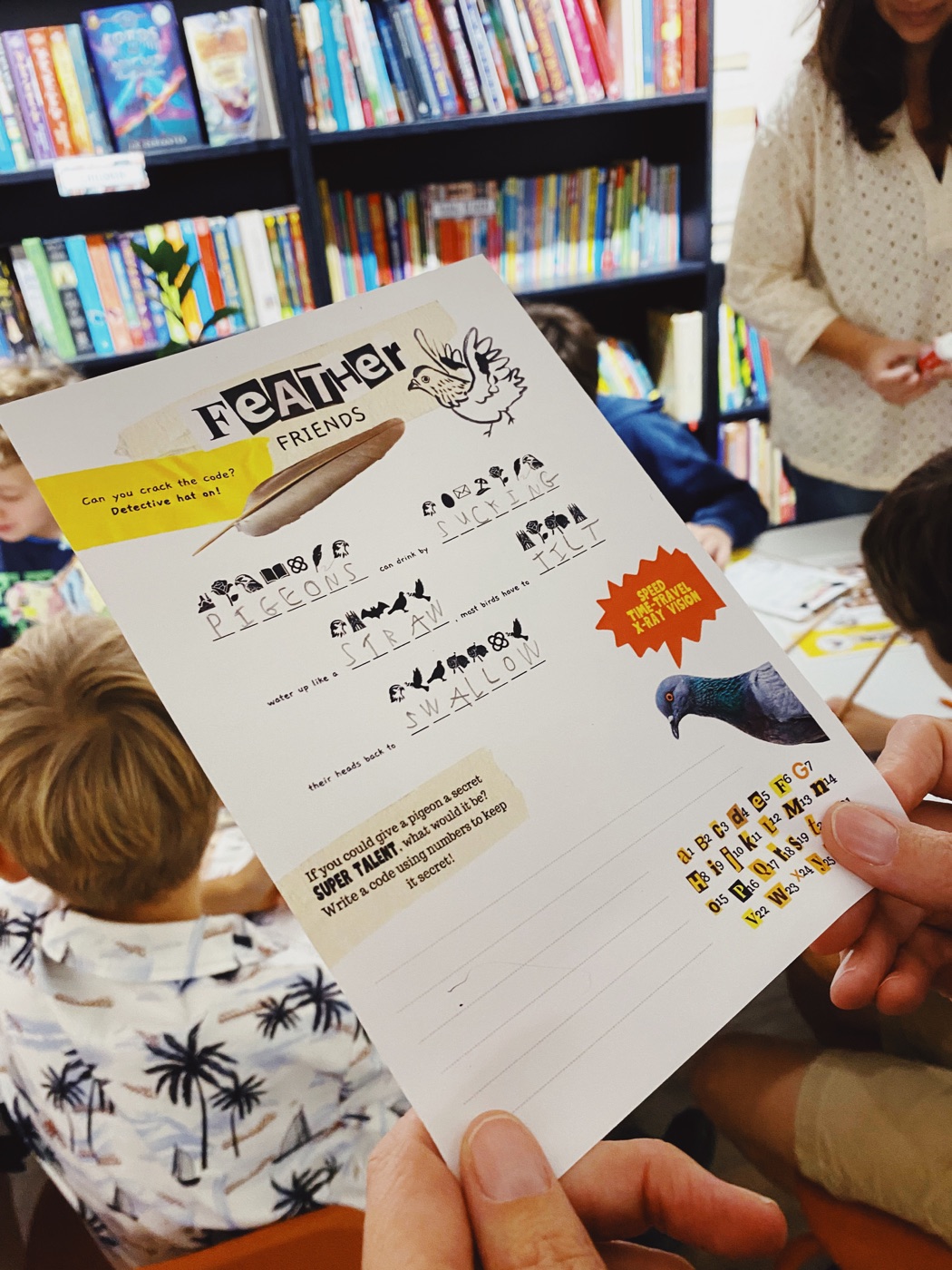 A child solving a secret code at Backstory Bookshop